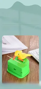 Detail view of bird toothpick dispenser made of food-grade ABS material on wooden desk
