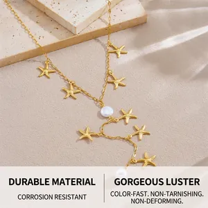 Detail of gold starfish and pearl pendant necklace on a textured stone surface
