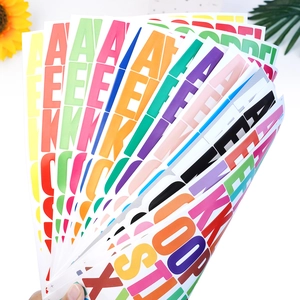 Close-up of colorful 1.5-inch vinyl alphabet stickers in various vibrant shades and fonts