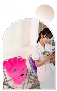 Close-up of creative soft plush foot-shaped pillows with cute embroidered facial features