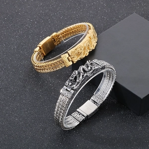 Détail de bracelets dragon en or et argent en acier inoxydable 316L style punk