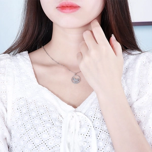 Detailed view of silver horse silhouette pendant on a delicate cable chain necklace