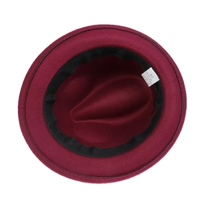 Close-up of wine red fedora hat interior showing size 57 label and cotton blend lining