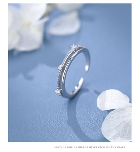 Macro detail of S925 sterling silver double-layered ring with sparkling white zircons
