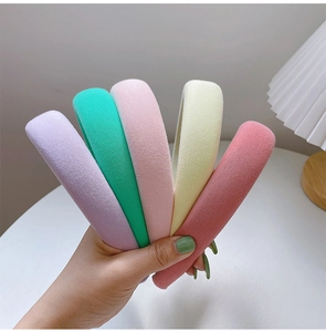 Macro detail of colorful thick sponge headbands in purple, mint green and yellow colors