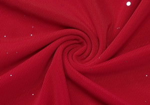 Detail shot of red sequin fabric texture with silver glitter on the tiered dress