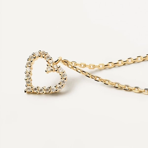 Golden heart pendant necklace with shimmering crystals on a delicate link chain