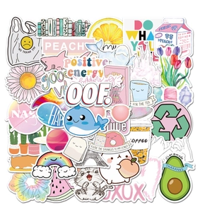 Flat lay of colorful VSCO stickers for luggage and laptops with various cute patterns