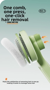 Detail showing the one-click self-cleaning pet brush with collected white animal fur