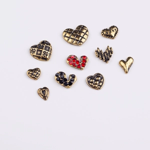 Vintage heart alloy nail art charms in gold finish with red and black crystals