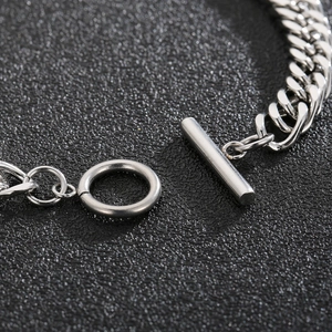 Polished silver titanium steel curb chain bracelet featuring a secure T-bar OT closure