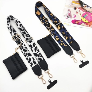 Detail set of wide woven leopard print shoulder straps with mini pouches and metal hooks