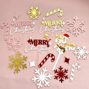 Christmas acrylic cake topper detail showing festive snowflake and candy cane dessert decor.