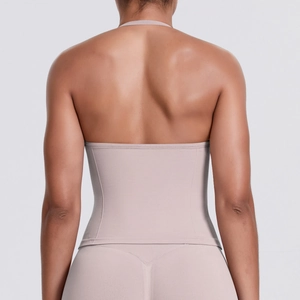 Detail of cross-back halter sports bra with seamless high-elastic fabric and flat back cut