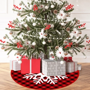 Classic red and black buffalo plaid Christmas tree skirt with large white snowflake print