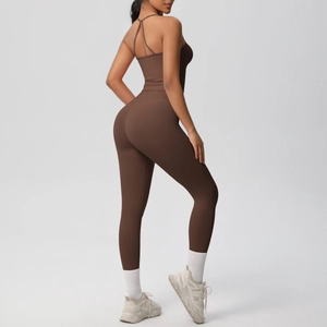 Detail of dark brown backless yoga set with crisscross straps and high waist leggings