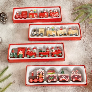 Festive wooden Christmas train ornaments set with four different holiday themed designs