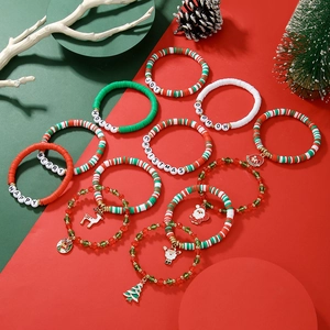 Christmas beaded bracelet set with Joy lettering, clay discs, and festive charms decoration