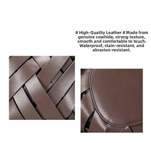 Detail of hand-woven genuine leather texture and stitching on dark brown basket bag