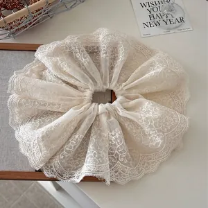 Elegant beige double-layer lace scrunchie with floral embroidery and wavy edges