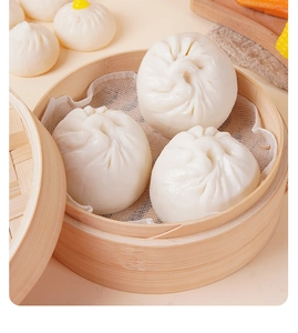 Detailed view of realistic PVC steamed buns models inside a traditional bamboo steamer