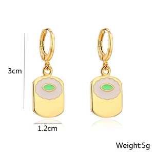 Detail view of 18K gold plated rectangular earrings with eye pattern, 3cm by 1.2cm