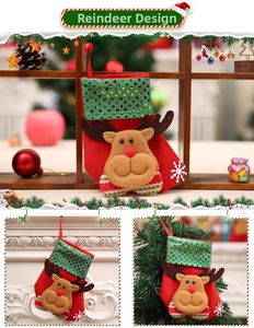 Detail of red Christmas stocking with 3D reindeer design and shiny green sequins decoration