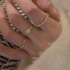 Gold plated 3-piece stacking ring set with zircon heart charm and wavy band for women