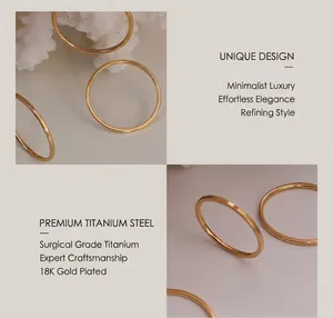 Detail of minimalist 18k gold plated surgical titanium steel rings with a smooth finish