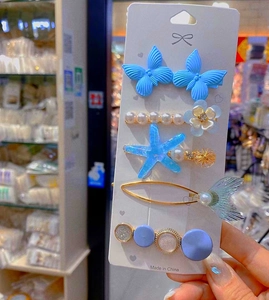 Five-piece candy-colored blue butterfly hair clip set with pearls and star details