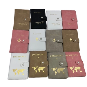Flat lay display of multi-color RFID PU leather passport holders with snap button closure