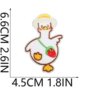 Detailed view of white duck embroidery patch with strawberry bag measuring 6.6cm by 4.5cm