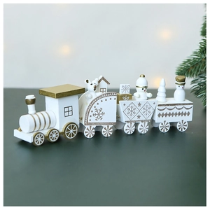 Detailed view of a white and gold wooden Christmas train with snowman and bear figures