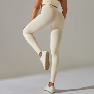 Detailed knit texture of beige seamless high-waist yoga pants with butt-lifting design