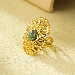 French vintage style stainless steel ring with green stone and hammered gold finish