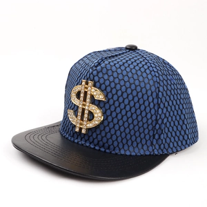 Close-up of hip hop snapback cap with a crystal studded gold dollar sign metal badge