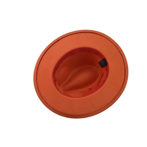 Detail of orange fedora interior showing 65% cotton blend label and red sweatband