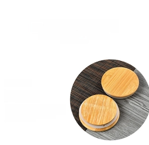 Close-up of bamboo lids with silicone sealing rings for airtight glass storage jars