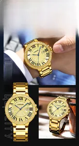 Close-up of gold stainless steel watch dial with Roman numerals and diamond bezel
