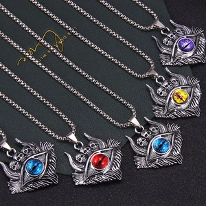 Detailed macro view of five gothic skull pendants with colorful evil eye center pieces