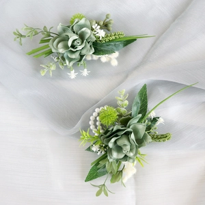 Sage green faux succulent boutonniere set with pearls for wedding and business events