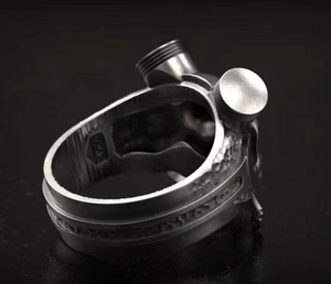 Macro shot of mechanical punk silver ring showing S925 hallmark and brushed industrial textures
