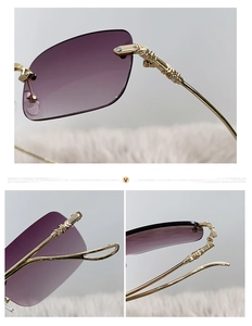 Detail view of rimless gradient purple lenses and embossed gold metal temples