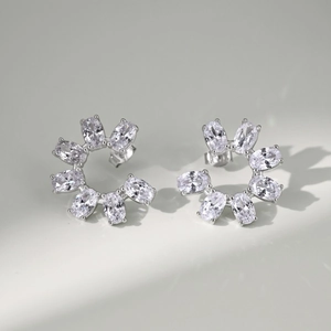 Detailed close-up of S925 silver bow earrings with oval cubic zirconia drop pendants