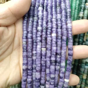 Close-up of 3x6mm purple and green natural stone spacer beads for DIY jewelry making