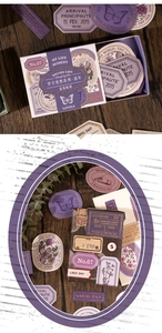 Detail of vintage scrapbooking stickers with gold foil and purple paper textures