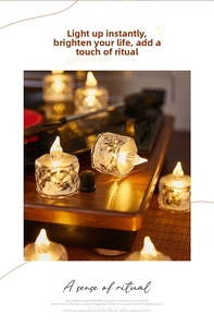 Detail view of acrylic crystal LED candle light on a vintage record player setting