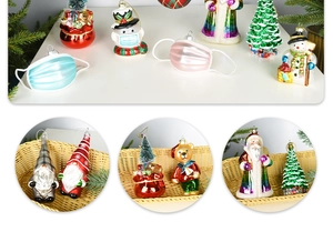 Detail of colorful glass Christmas ornaments with Santa, snowman and bear figurines