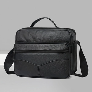 Classic black leather business briefcase with top handle and adjustable shoulder strap
