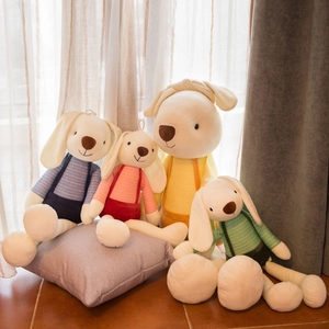 Adorable plush rabbits in colorful striped shirts and overalls for nursery decor